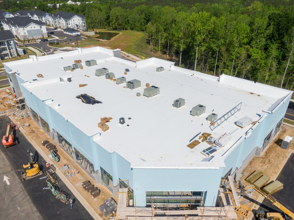Drone Images of TPO Flat Commercial Roof With Metal Panels: New & Existing Construction